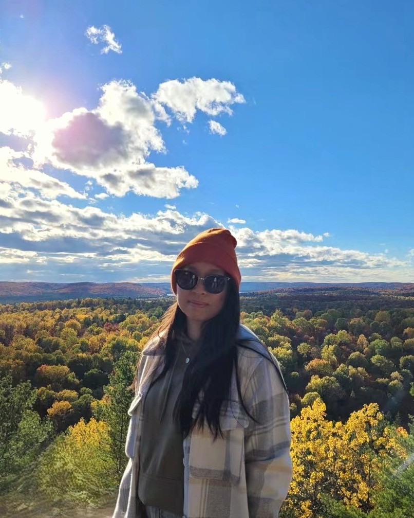 Melissa on a mountain with a nice fall view