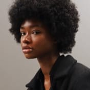 profile shot of Jessica Randall in a black shirt and a light grey background